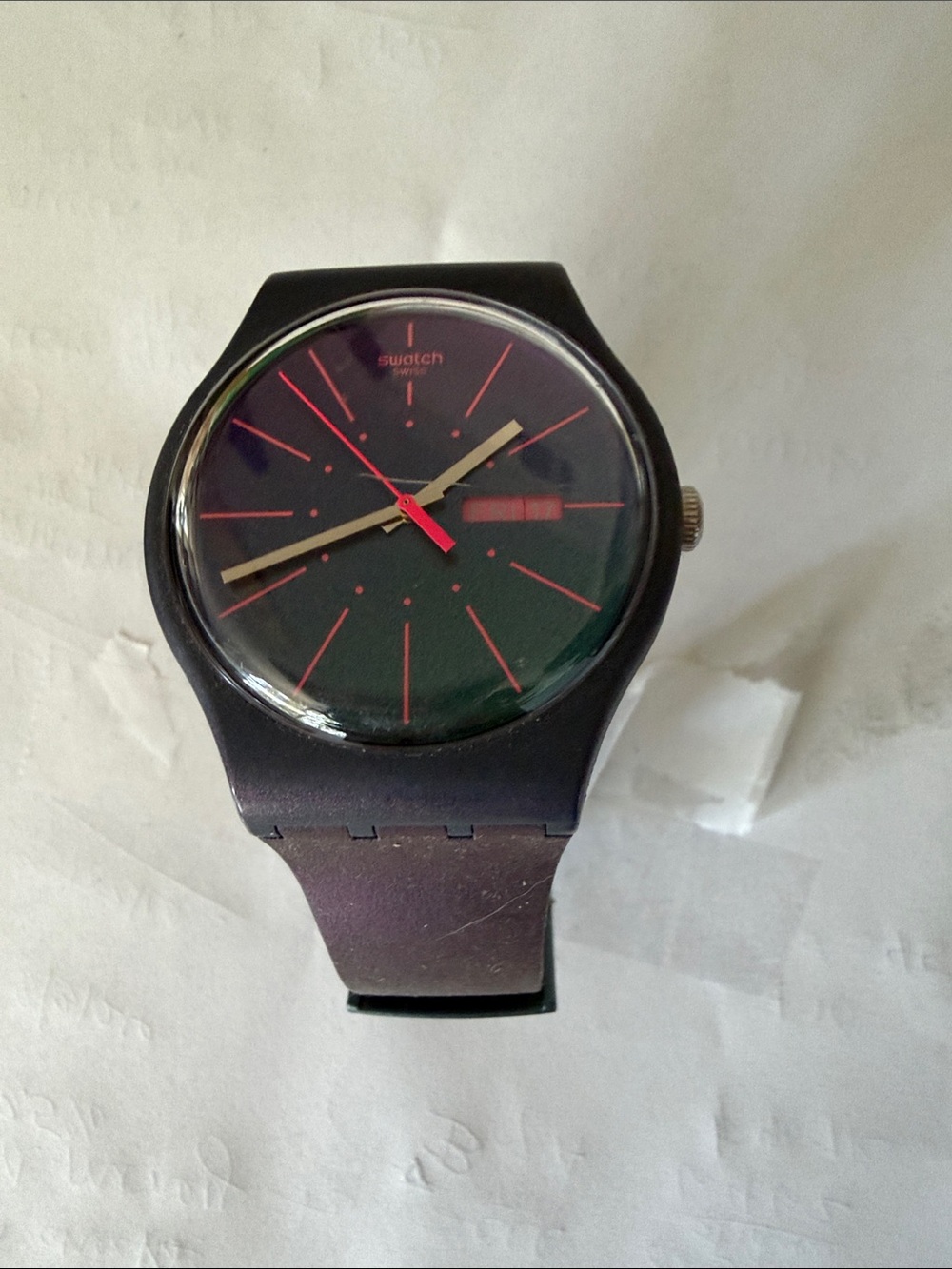 Swatch Black Watch with Red Dial Accents